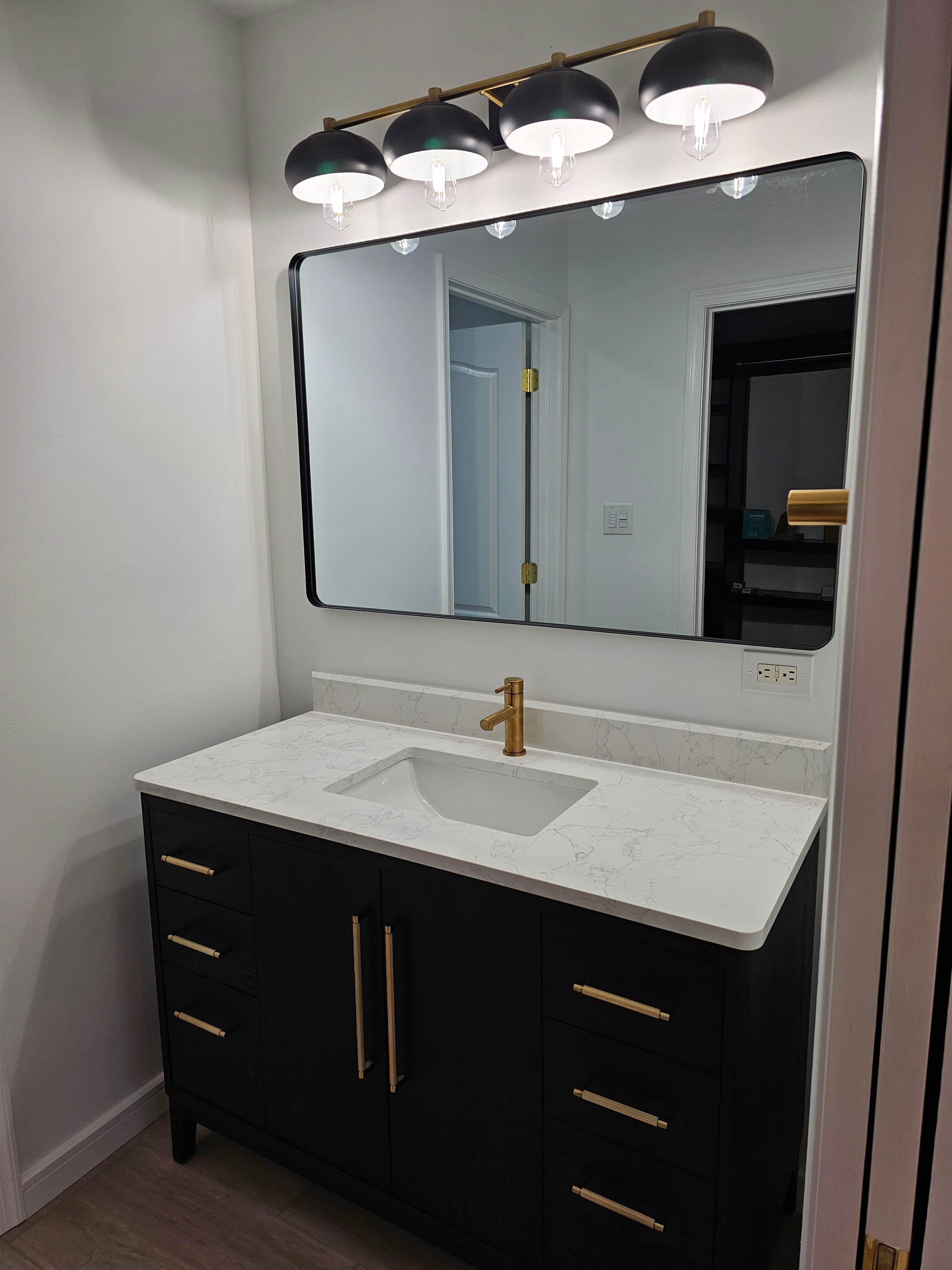 Sink with black cabinet